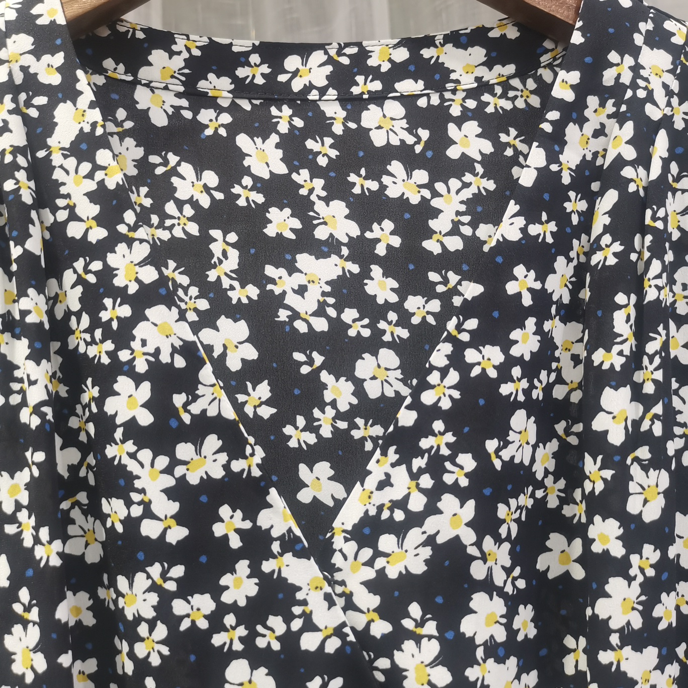 A large Y-neck natural-color wide-belted skirt with a big hem