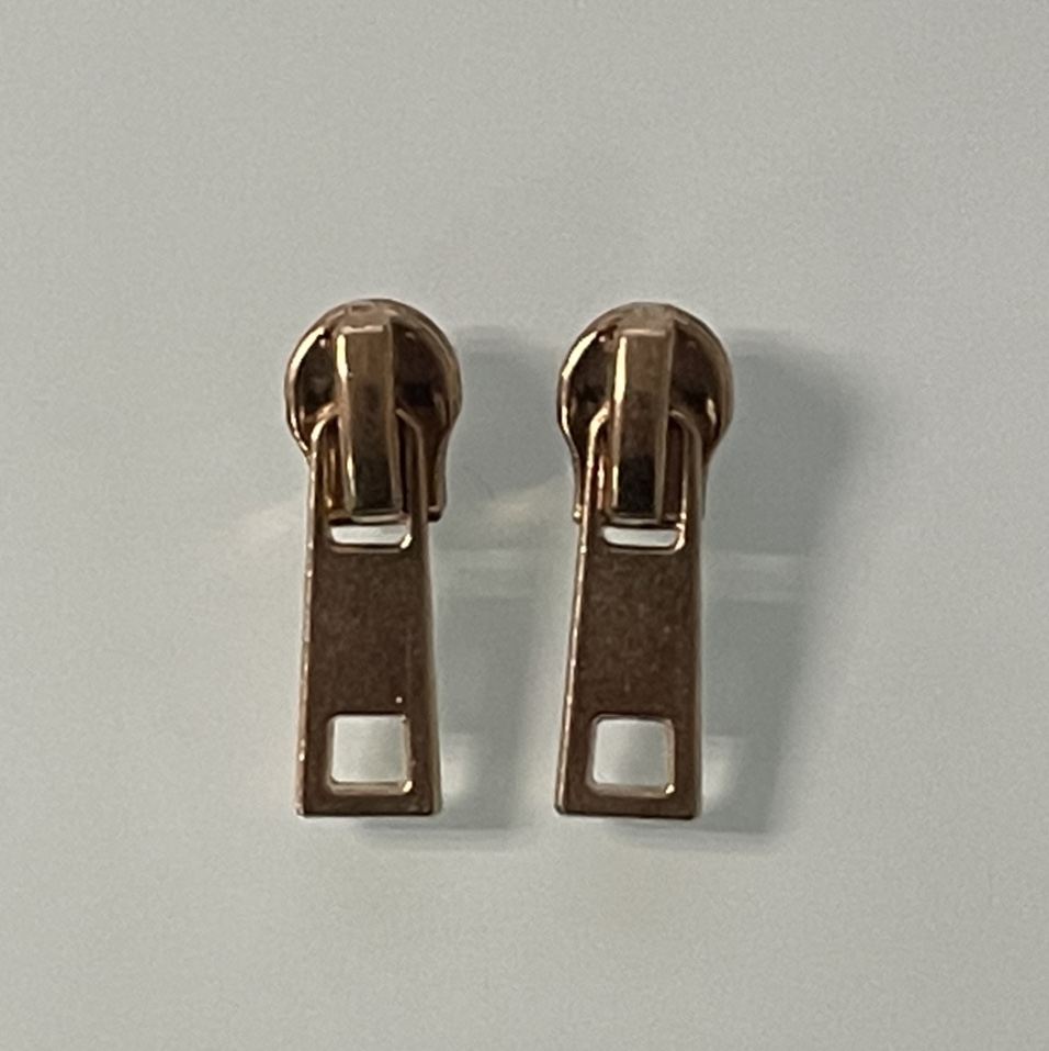 The No. 3 zipper pocket is decorated with a zipper pull