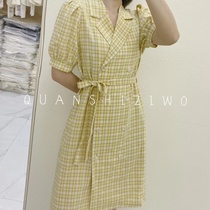 The dress is fitted with plaid