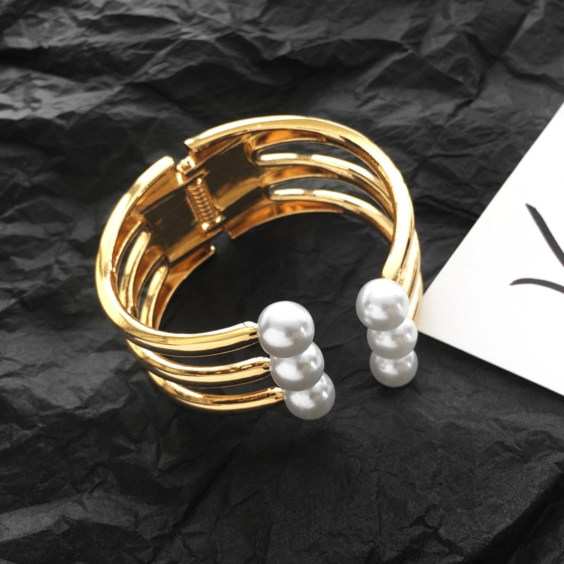An exaggerated multi-layer irregular semi-closed pearl wide-edge bracelet from Europe and America, a fashionable street style wristband for female Internet celebrities Item Picture