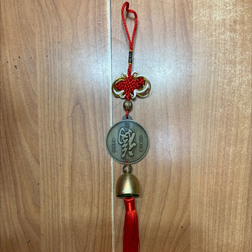 Hung copper bell as pendant