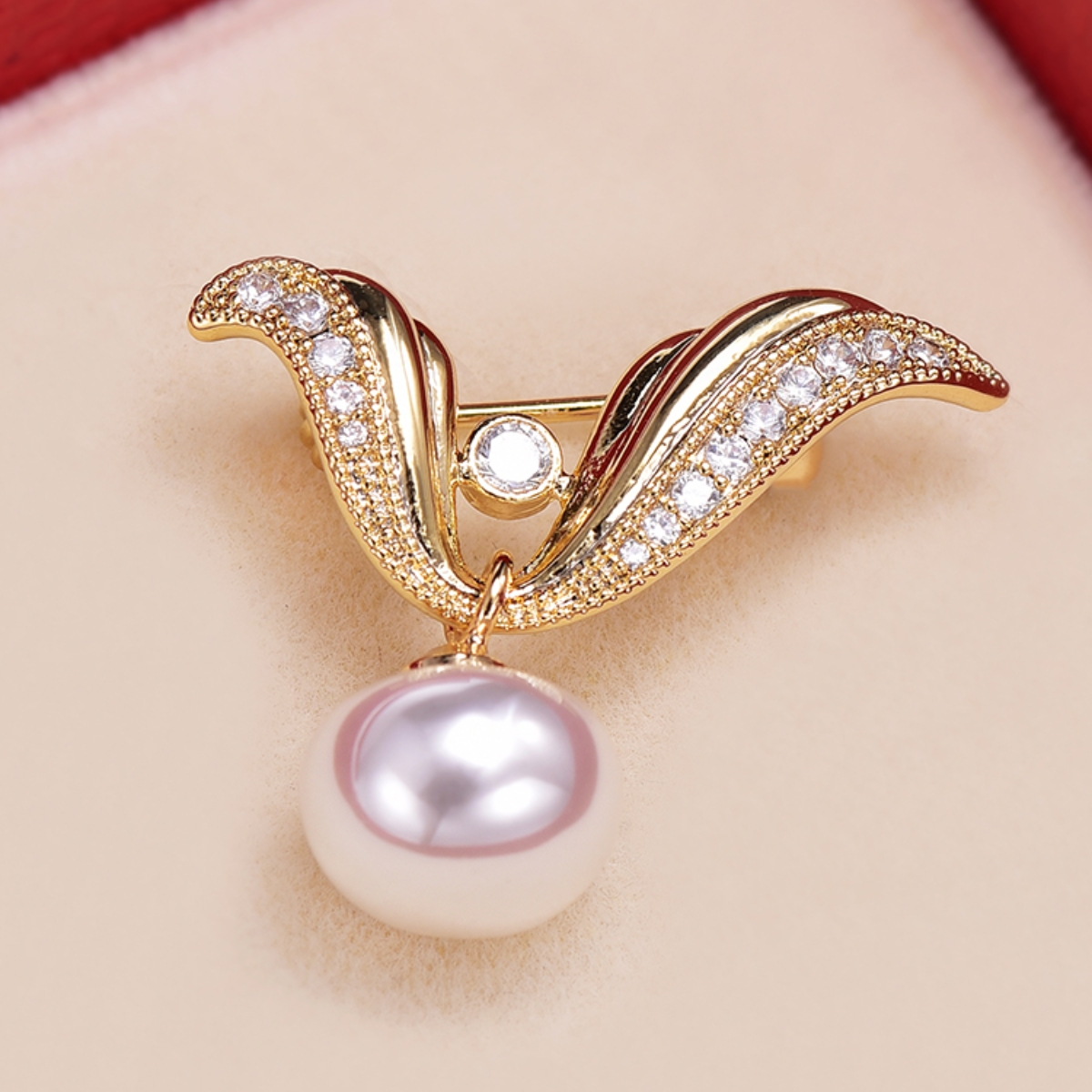 V brooch