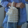 手工串珠成品水桶包女士春夏编织珍珠包宴会包流行手提包包女士背包白底实物图