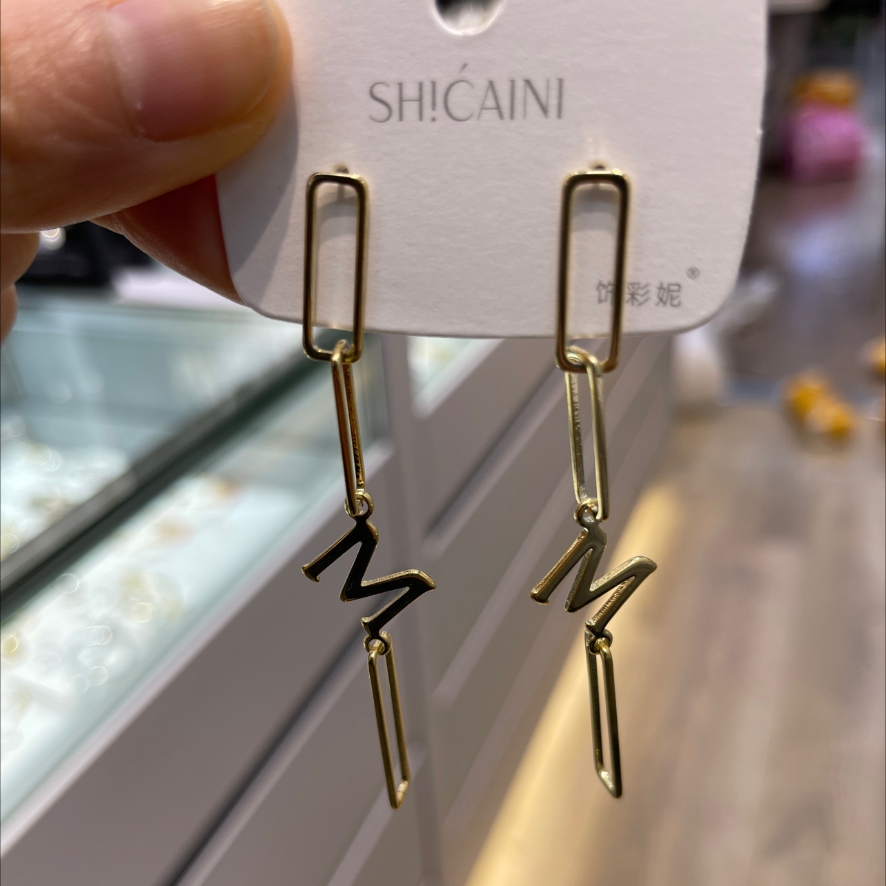 M square connected earrings