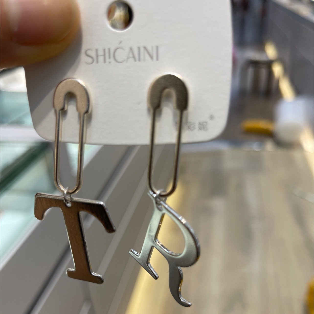 Monogram silver needle earrings