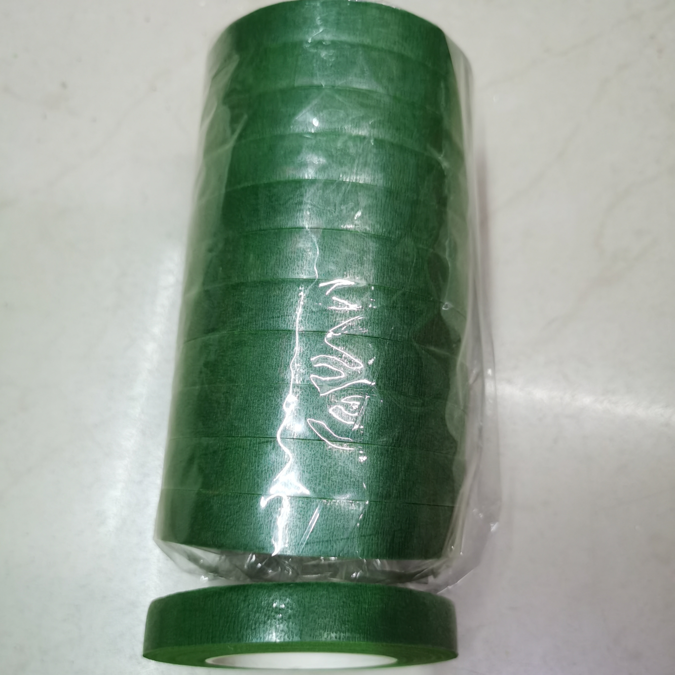 The tape is dark green