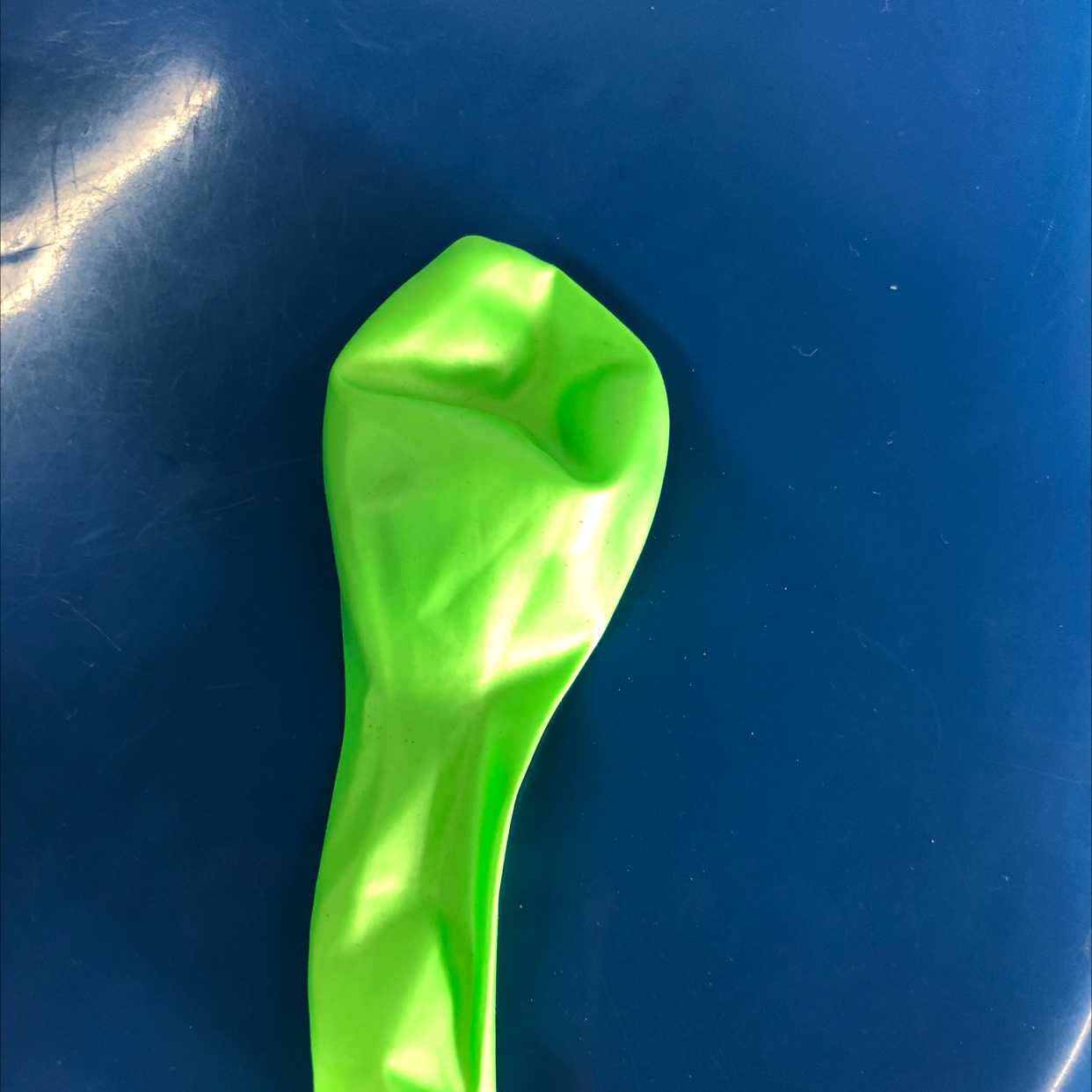 The pearlescent balloon is light green