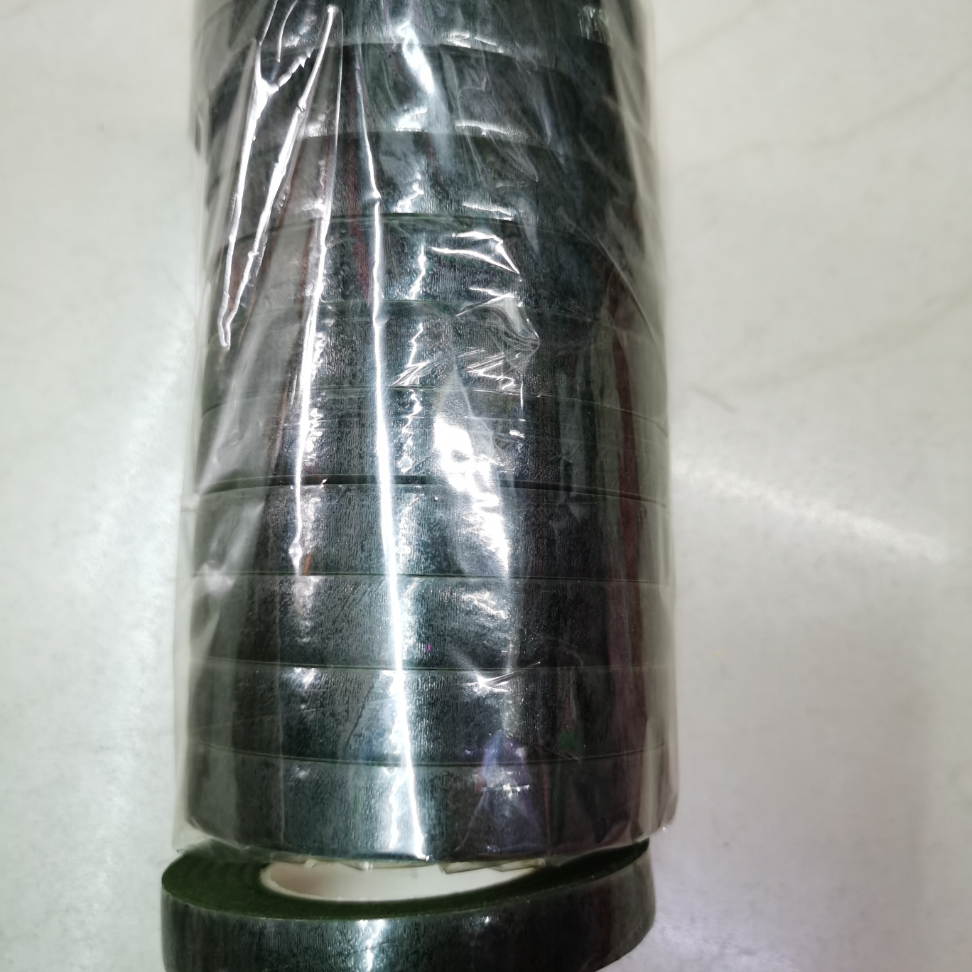 The tape is dark green