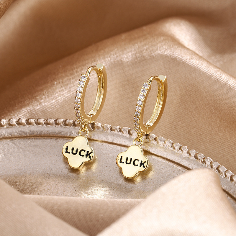 Niche design French earrings LUCK Luck Creative versatile earrings set with diamonds, letters, and drip glaze simple INS Application Scenario