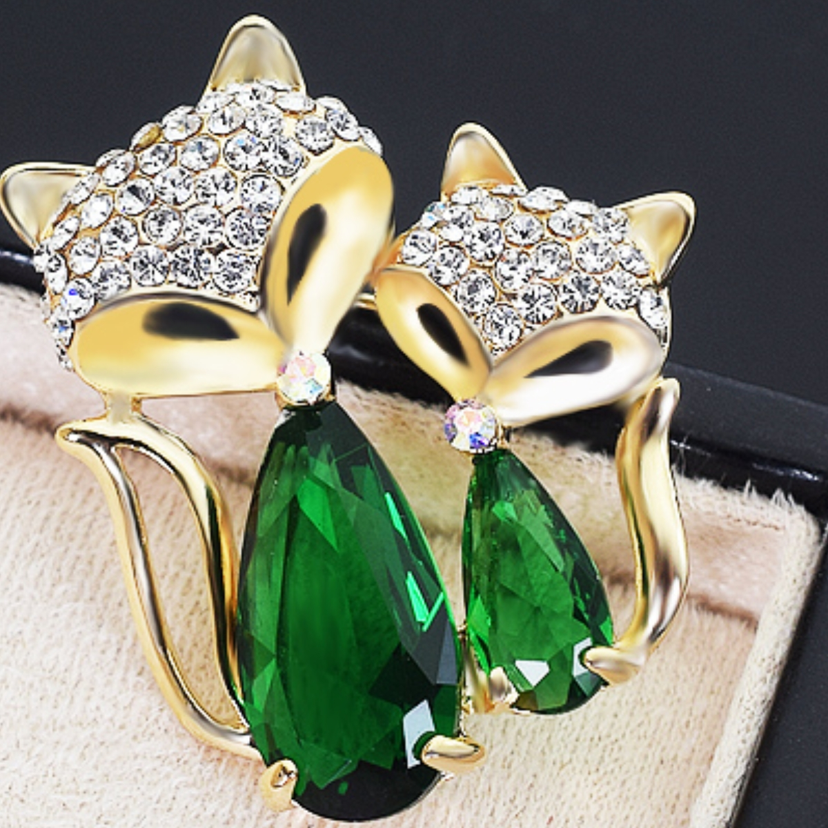 Two fox brooches