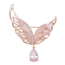 Asymmetrical wing brooch
