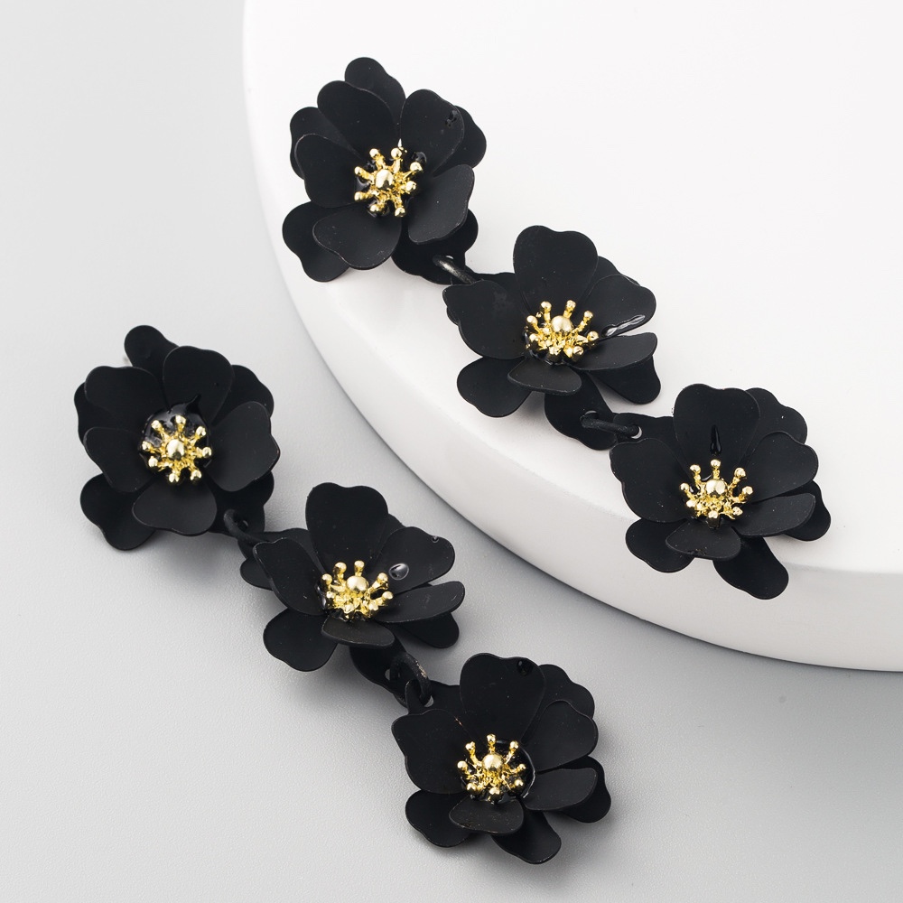 Three small flowers connected with long earrings, beautiful colors,
