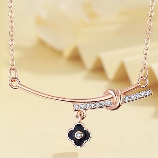 Smiling four-leaf clover necklace