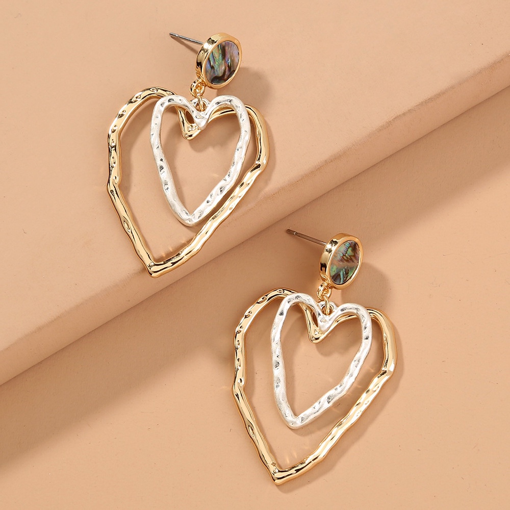 Two-tone, seashell stud earrings. Big metallic earrings with peach heart. Retro vibe.
