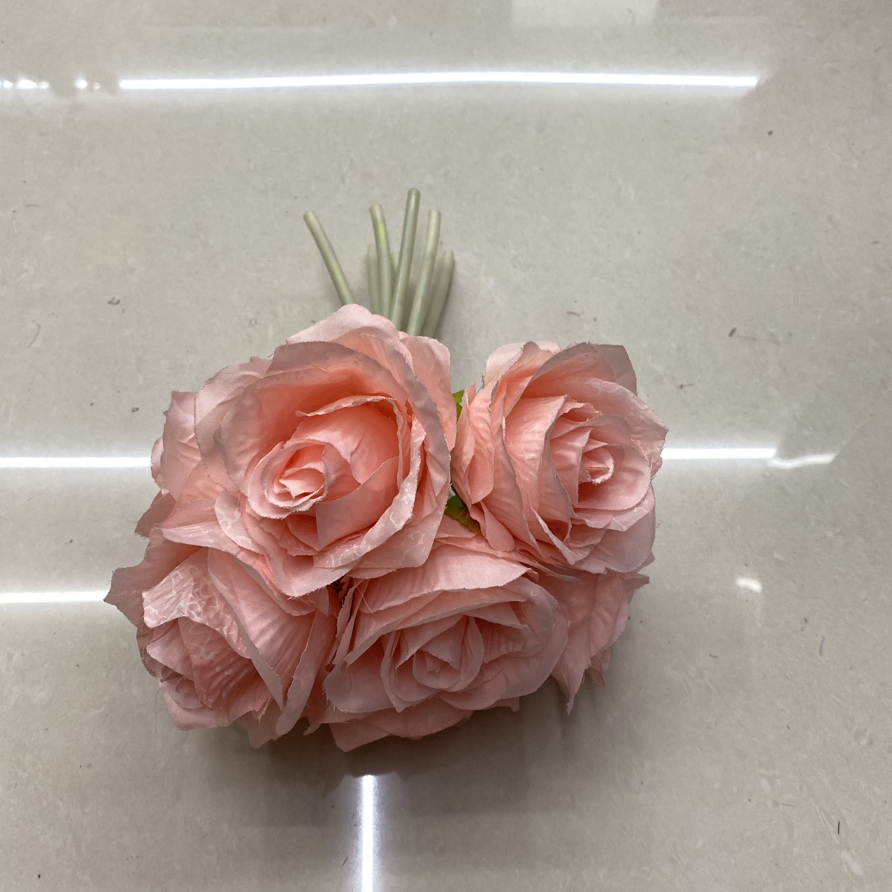 Light pink roses in hand