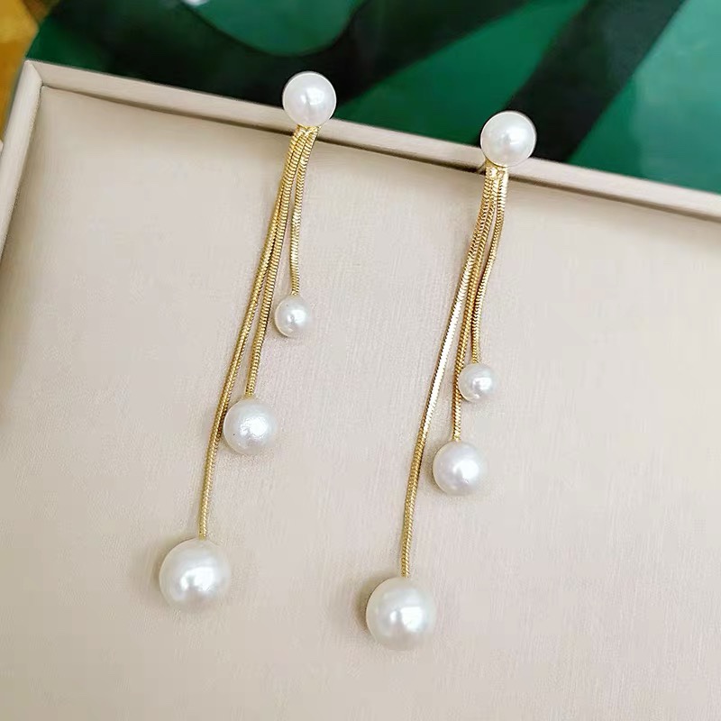 Pearl long tassel stud earrings for women to enhance elegance and shape the face. S925 sterling silver needle fashionable two-pair earrings that catch the eye