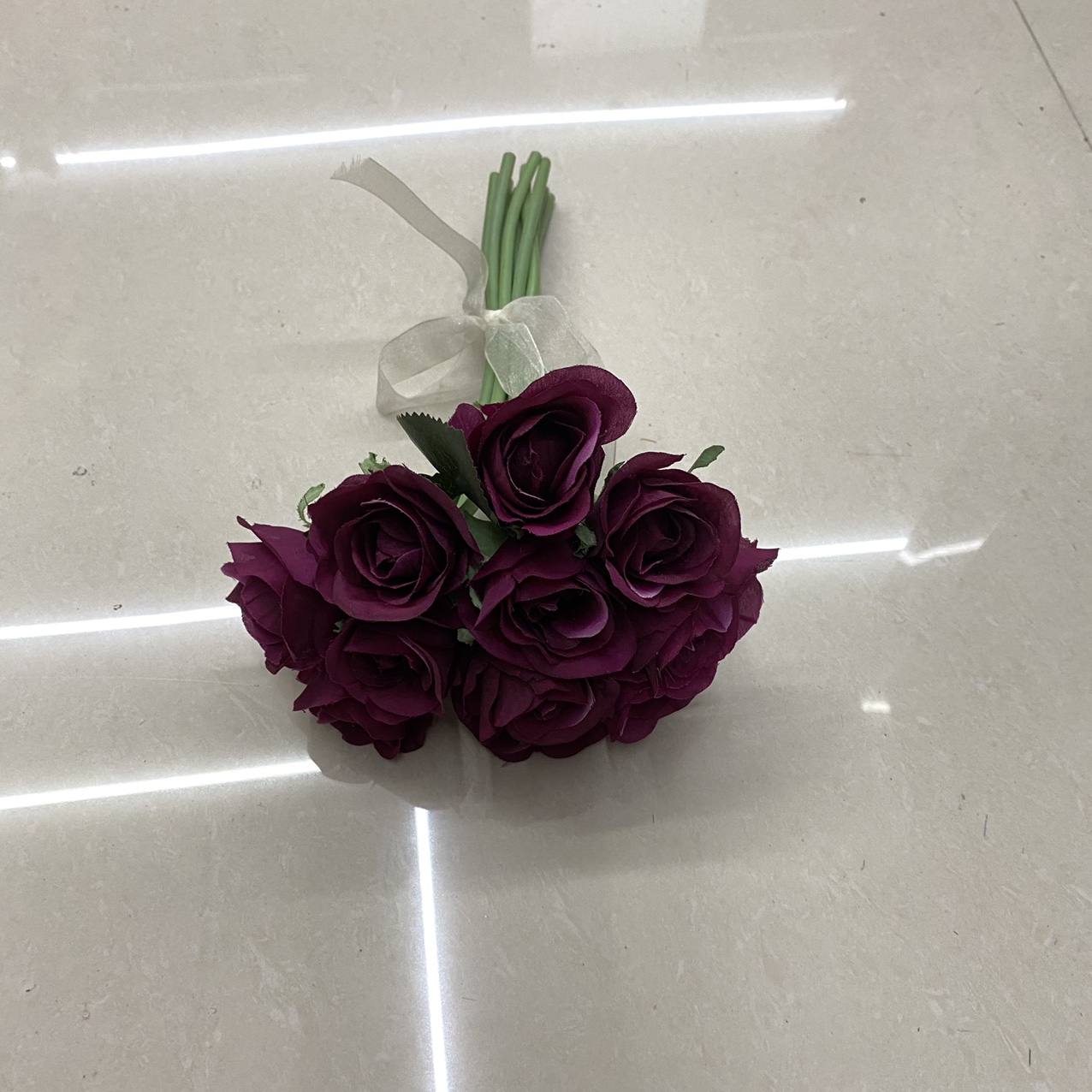 Burgundy ruffled green rose
