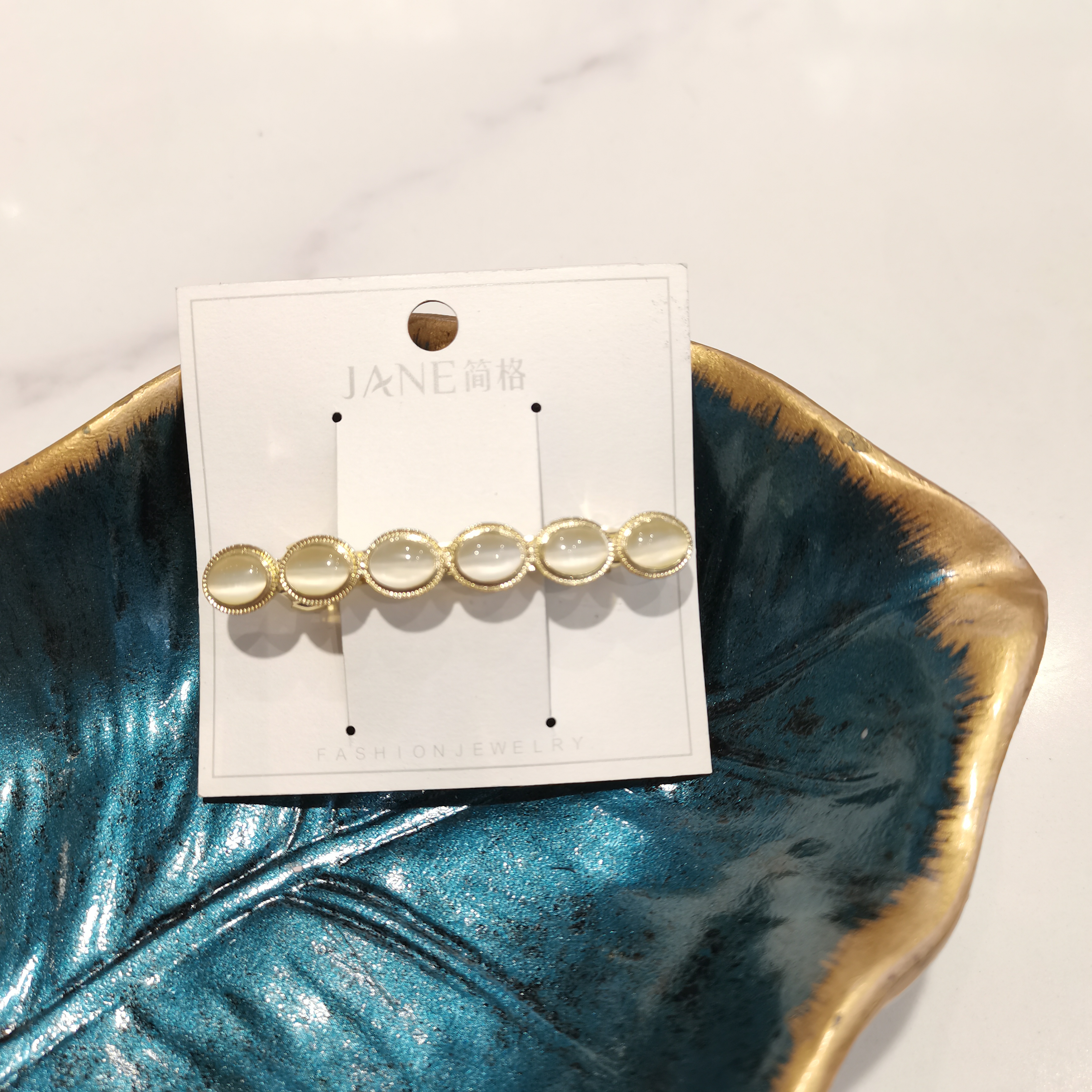 时尚百搭真金款白色款猫眼圆形高档款大气横夹