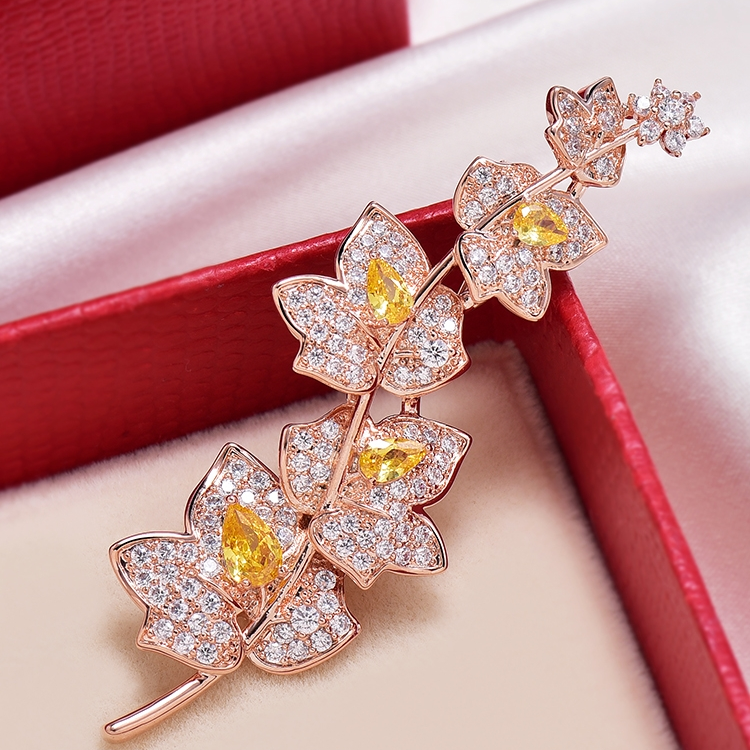 A bunch of leaf brooches