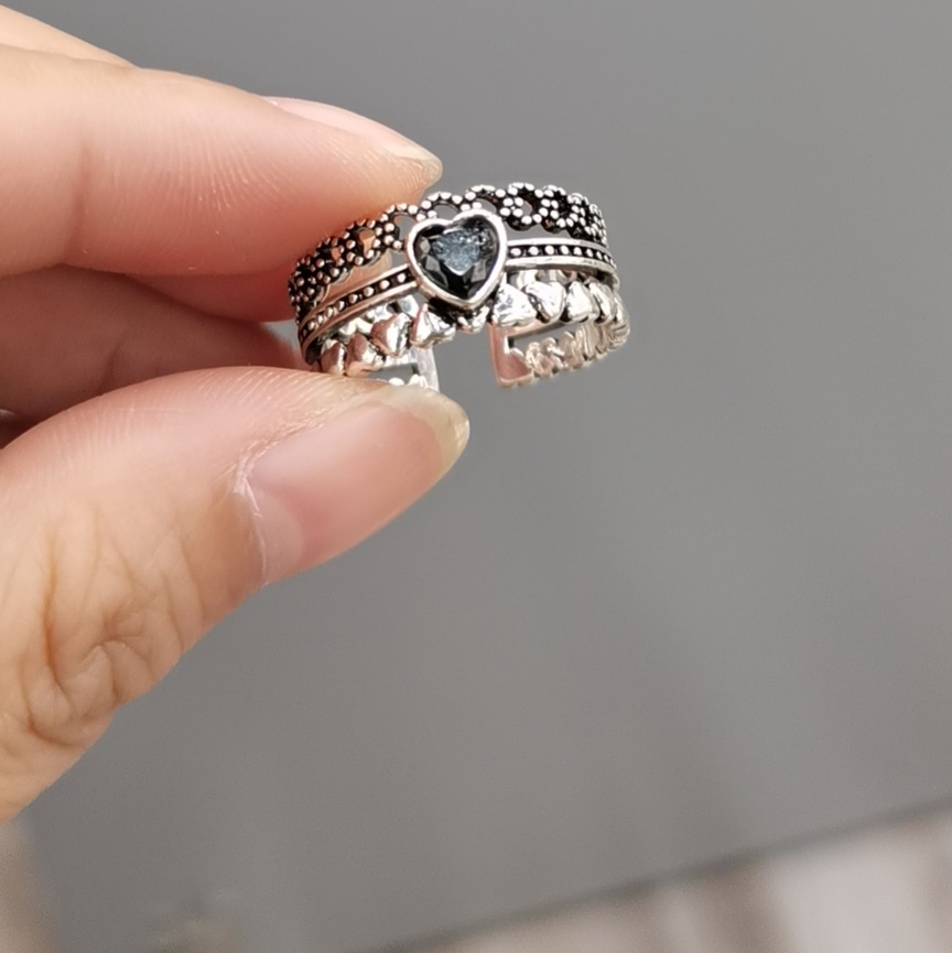 A Korean version of a wide, distinctive, thick and smooth open index finger ring with a twist pattern
