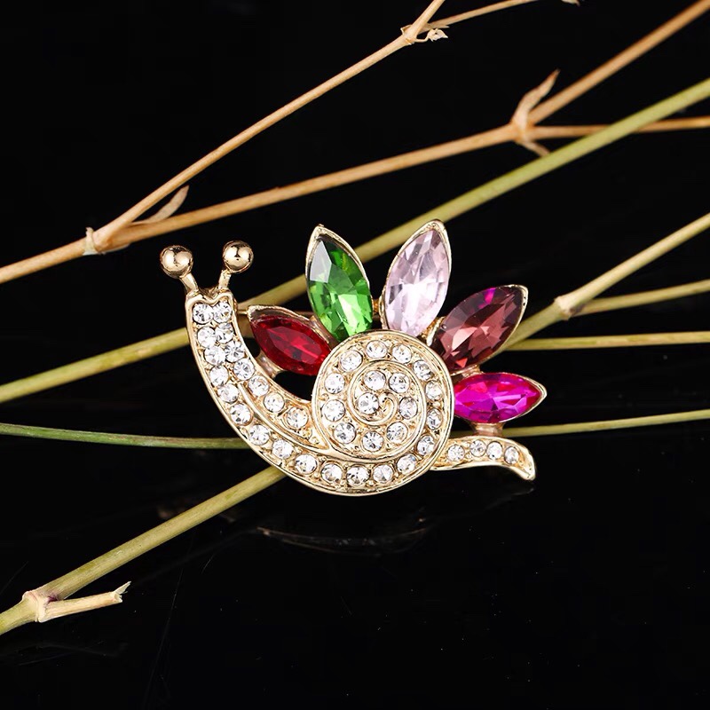 Rhinestone snail brooch