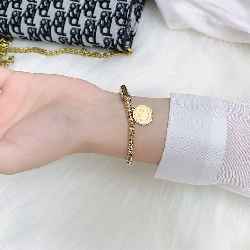 The Japanese and Korean smiley face round bead elastic bracelet is the same style as the female fashion Internet celebrity. It is versatile, unique and trendy Specification image