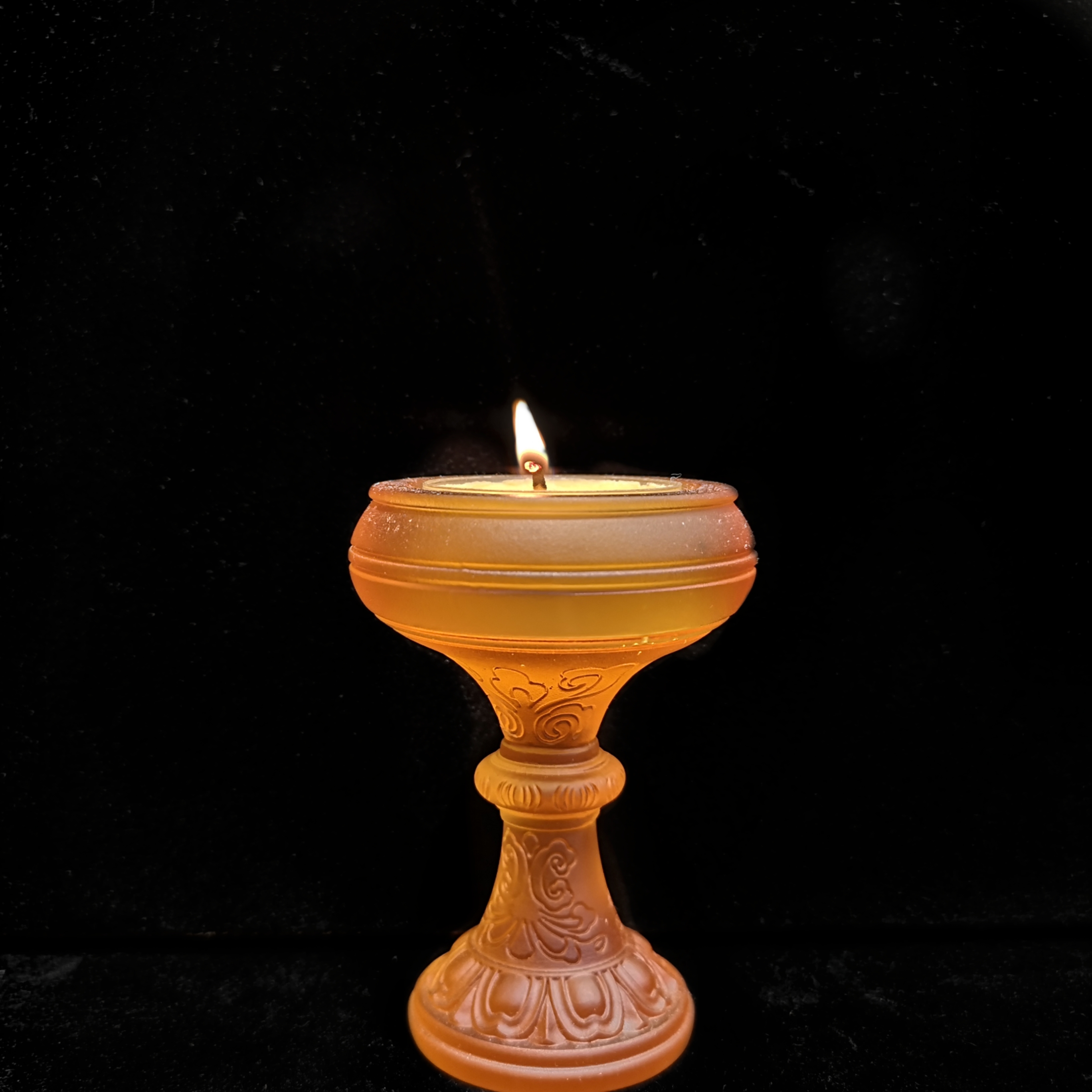 A glass amber candlestick