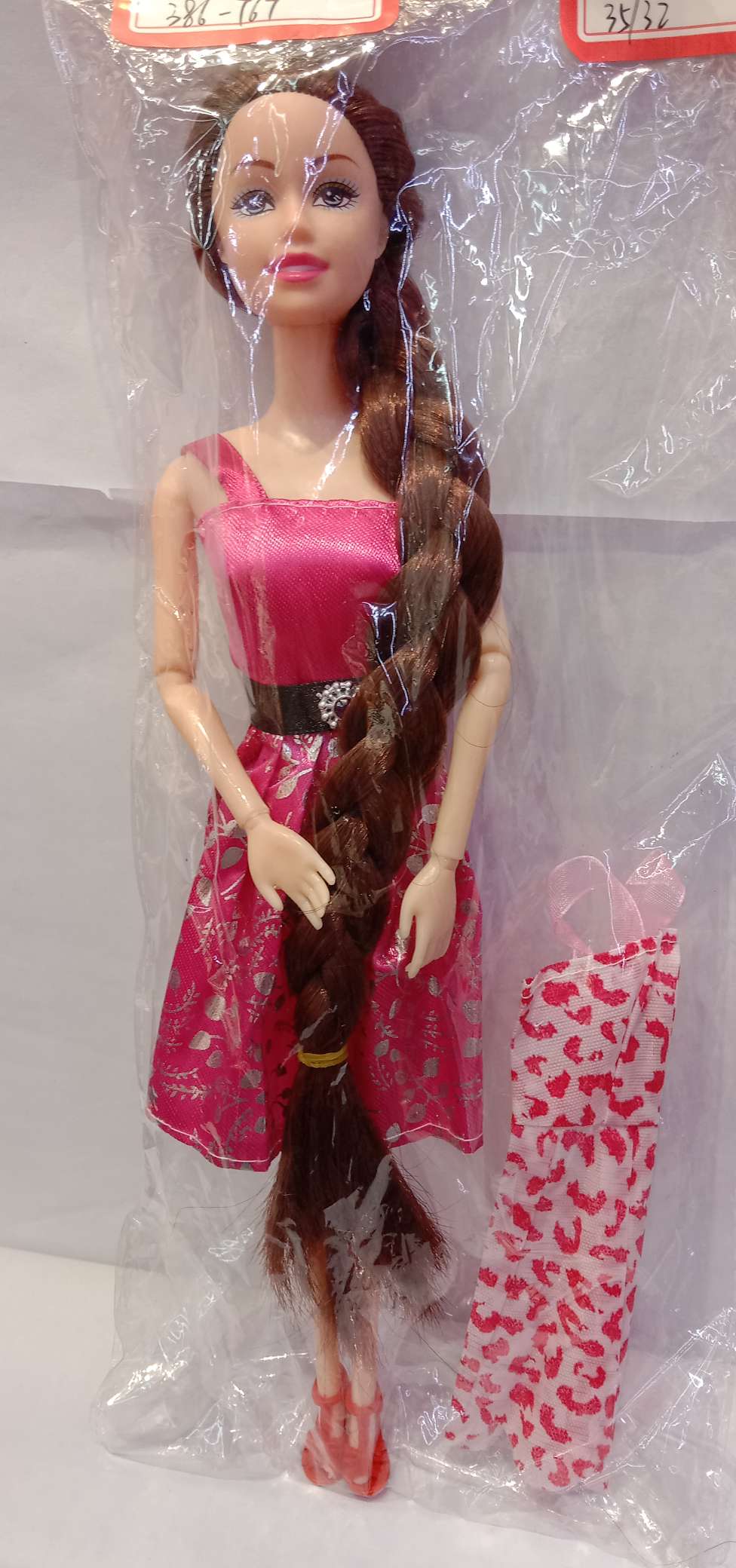A 11.5-inch articulated doll with long braids details Picture
