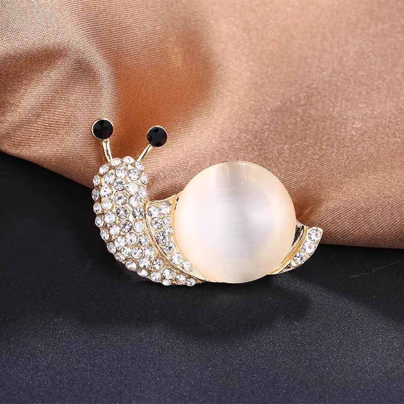 Pearl snail brooch
