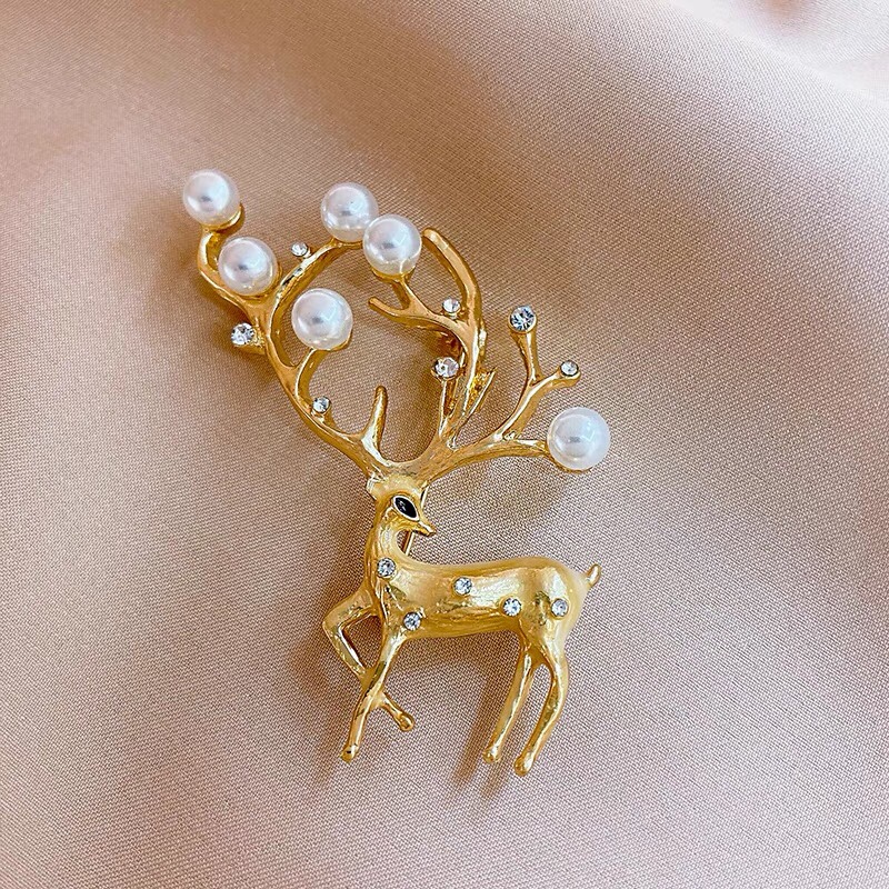 Gold sika deer brooch