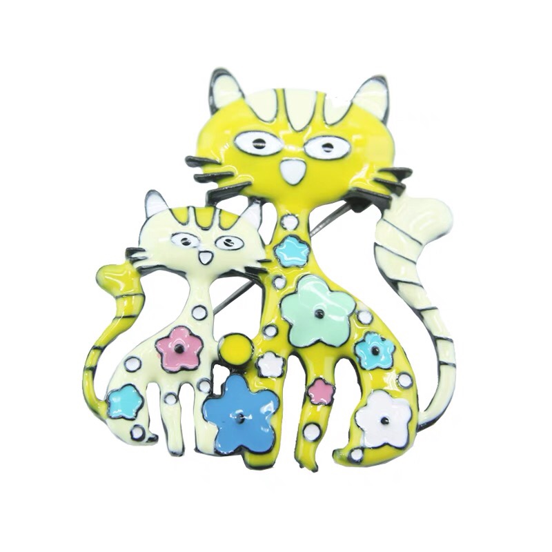 Three kitten brooches