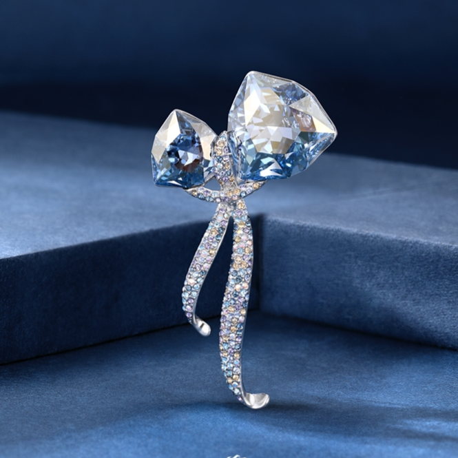 Two crystal brooches