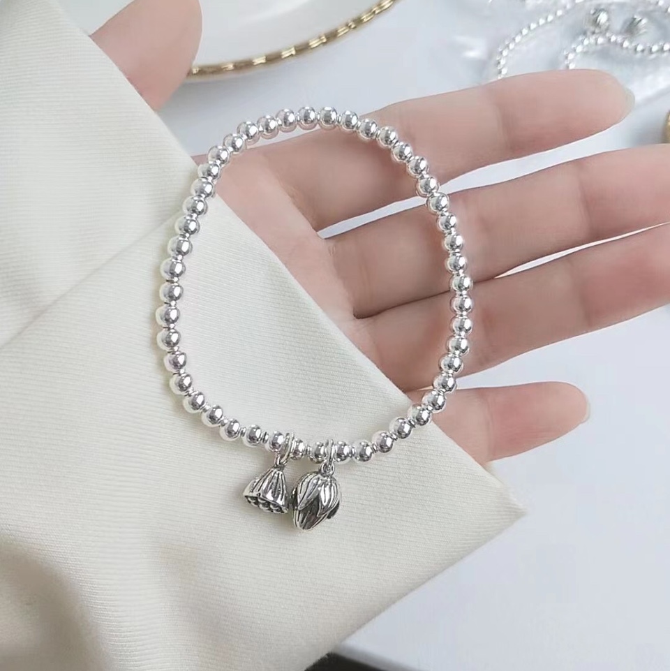 Pearl cross silver bracelet