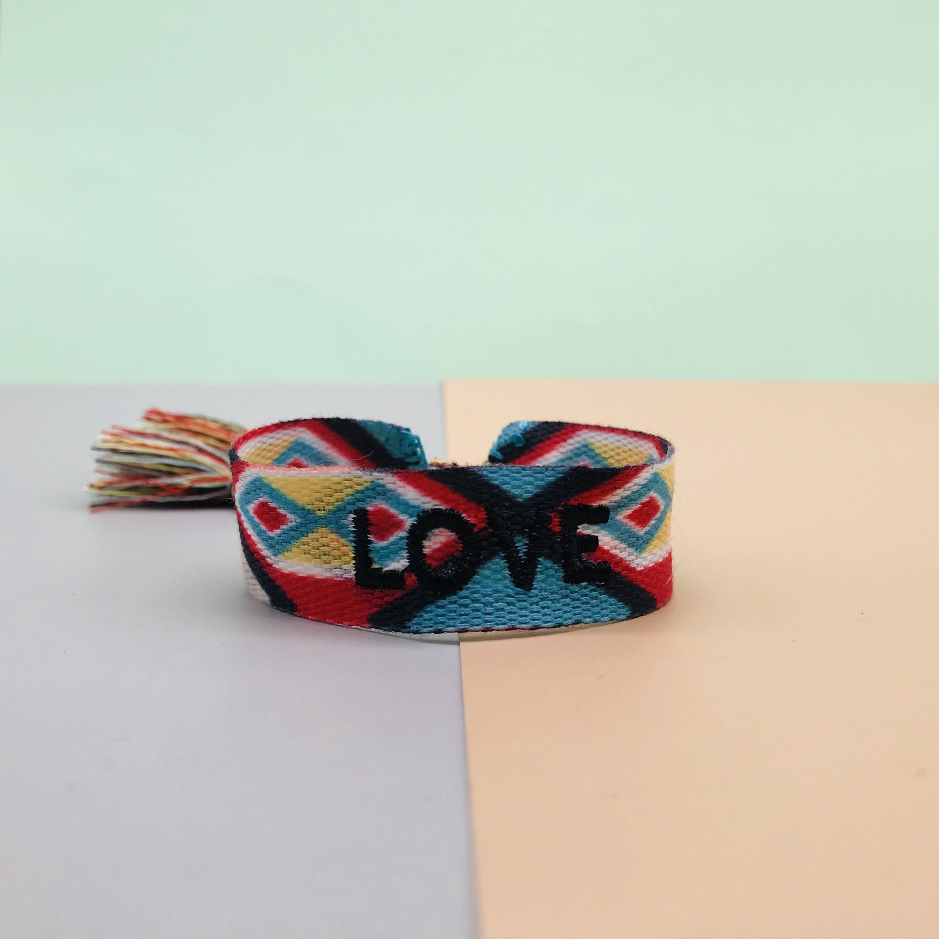 Factory direct sales of popular European and American accessories, simple and fashionable ethnic style wristbands, handcrafted tassel letter woven wristbands detail image 3