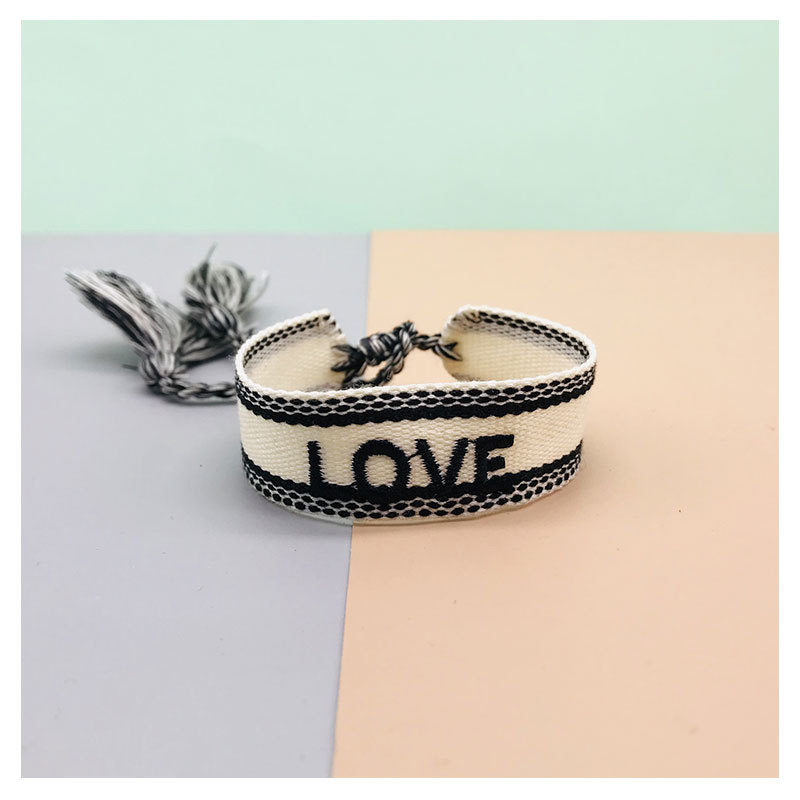 Factory direct sales of popular European and American accessories, simple and fashionable ethnic style wristbands, handcrafted tassel letter woven wristbands detail image 4