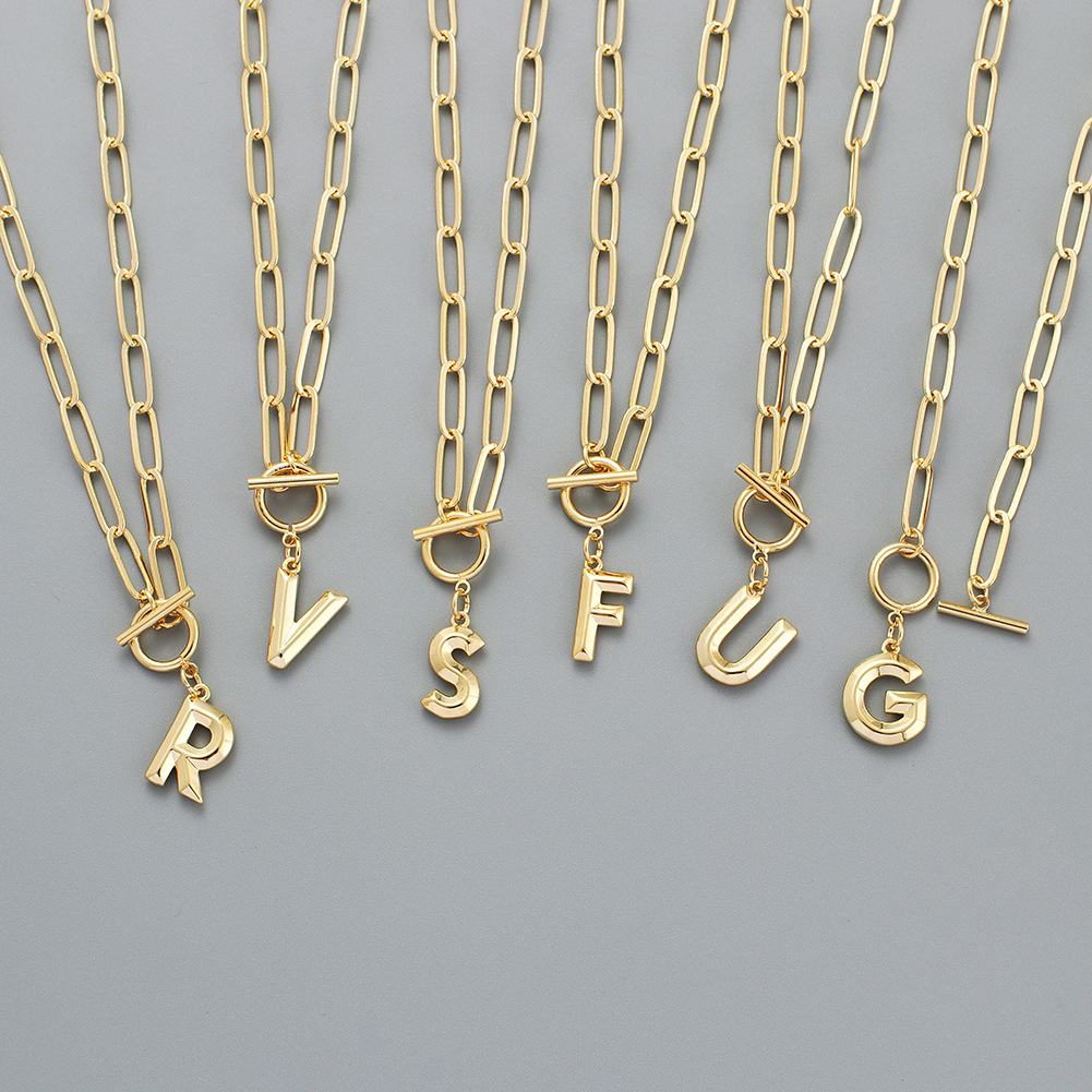 Wholesale of new OT button-and-wear copper English letter gold-plated sweater chain accessories for both men and women
