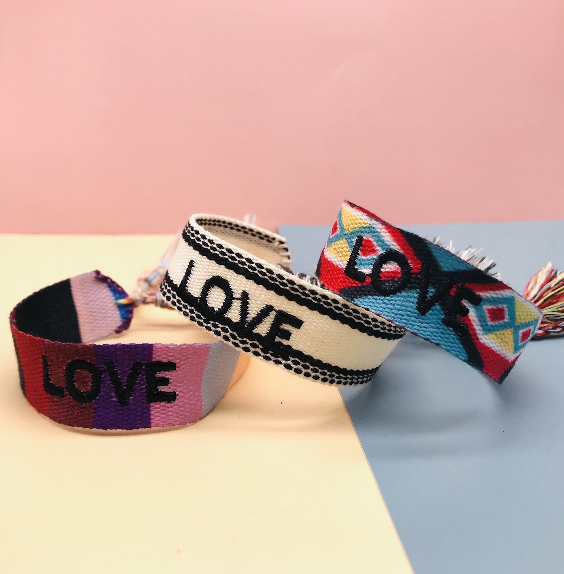 Factory direct sales of popular European and American accessories, simple and fashionable ethnic style wristbands, handcrafted tassel letter woven wristbands detail image 2