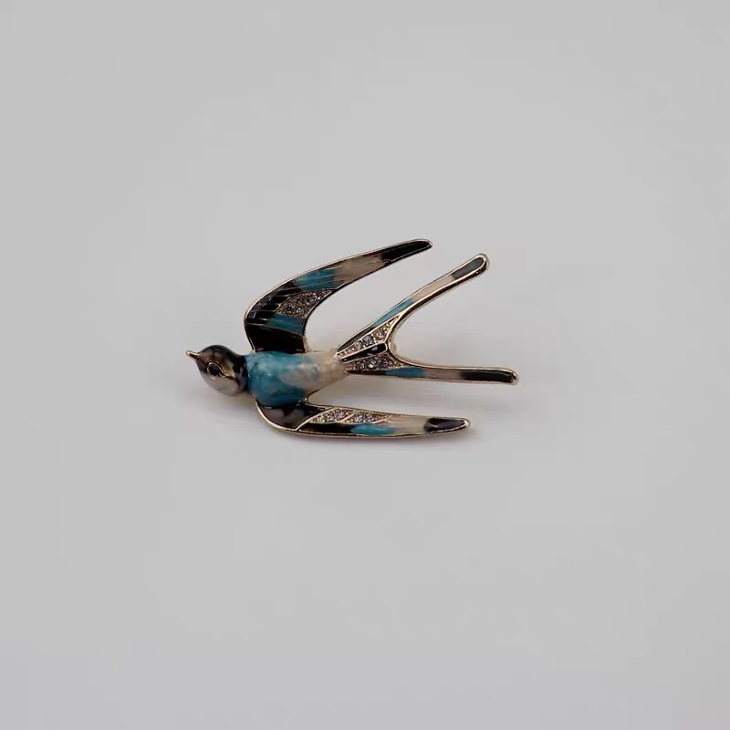 Painted swallow brooch