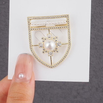 Shield brooch