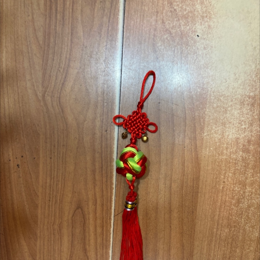 Yellow-green lucky ball number two hanging bell