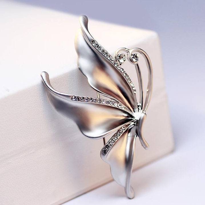 Silver flying butterfly brooch