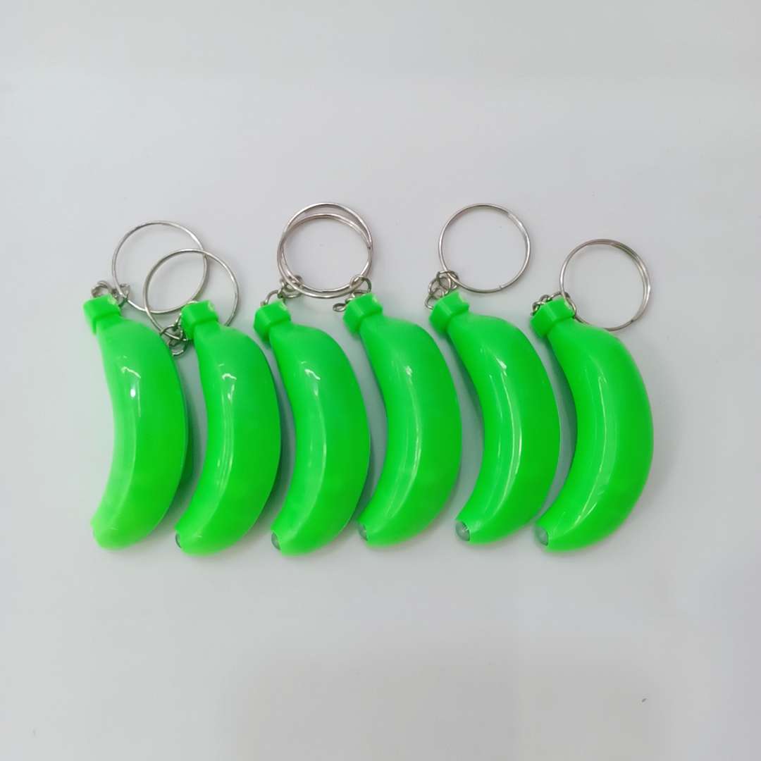 Keychain light white banana small gift event: Factory direct sales of luminous toys, keychain light, tall electronic toys 1 Specification image