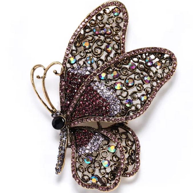 Hollow flying butterfly brooch