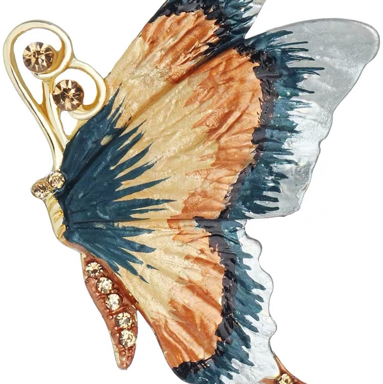 Flying butterfly brooch
