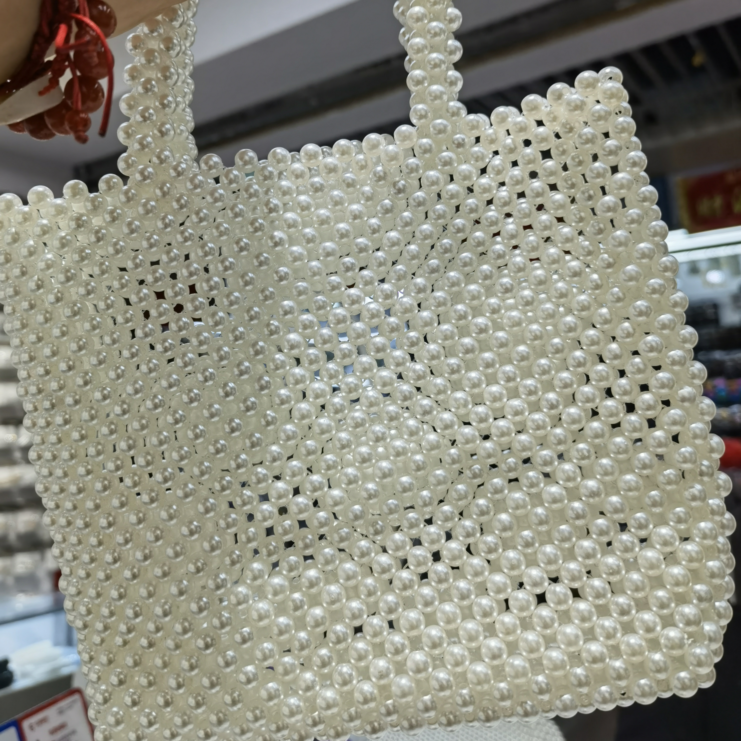 The 2021 new trendy pearl crossbody bag with a unique design is a must-have for women in summer