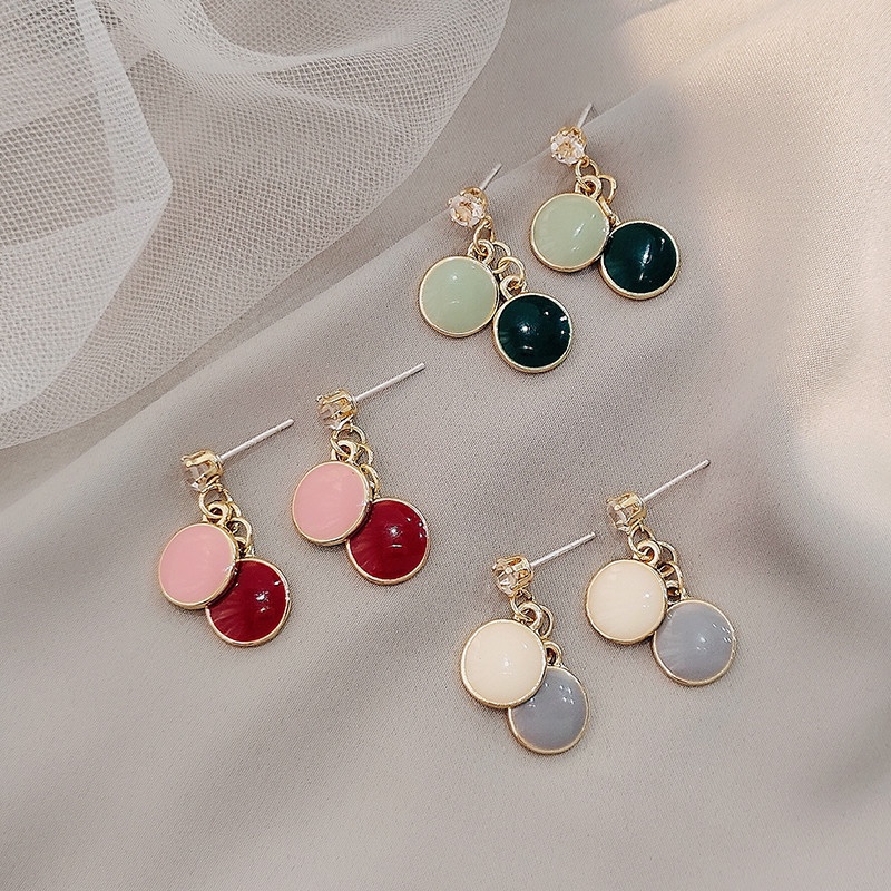 Disc overlapping drip earrings, shades.