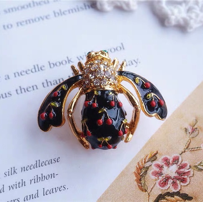 Cherry beetle brooch