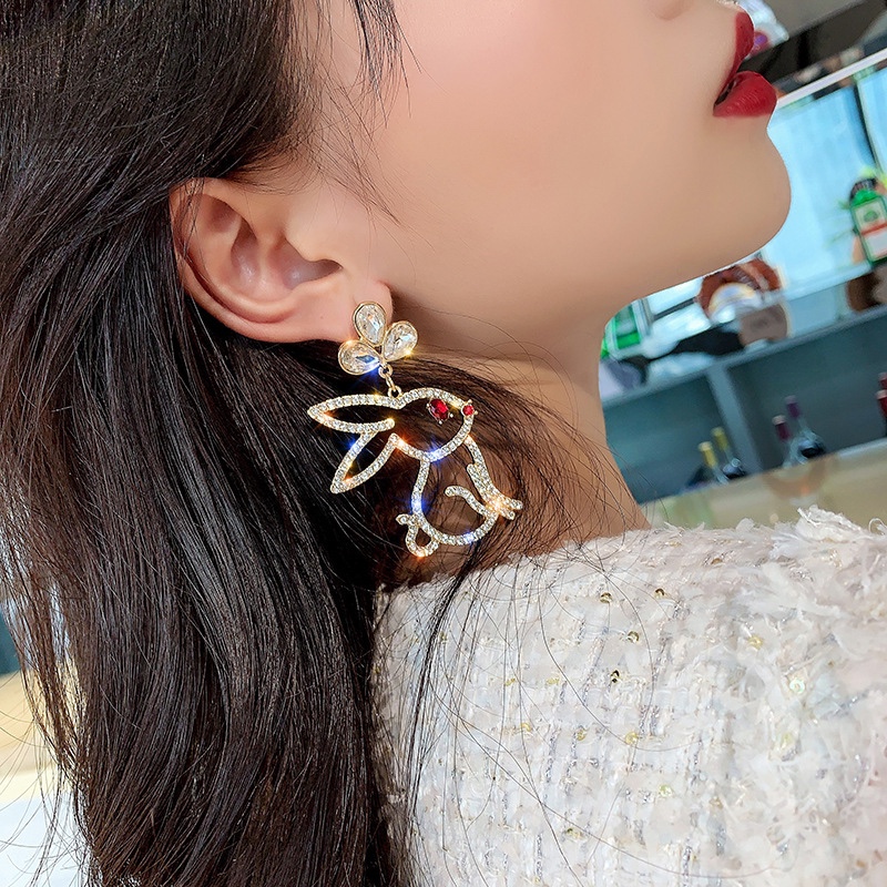 Big bunny full of diamond earrings, fashion trend.