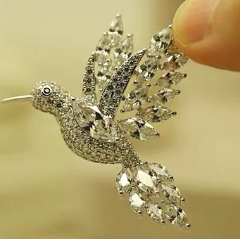Zircon woodpecker brooch