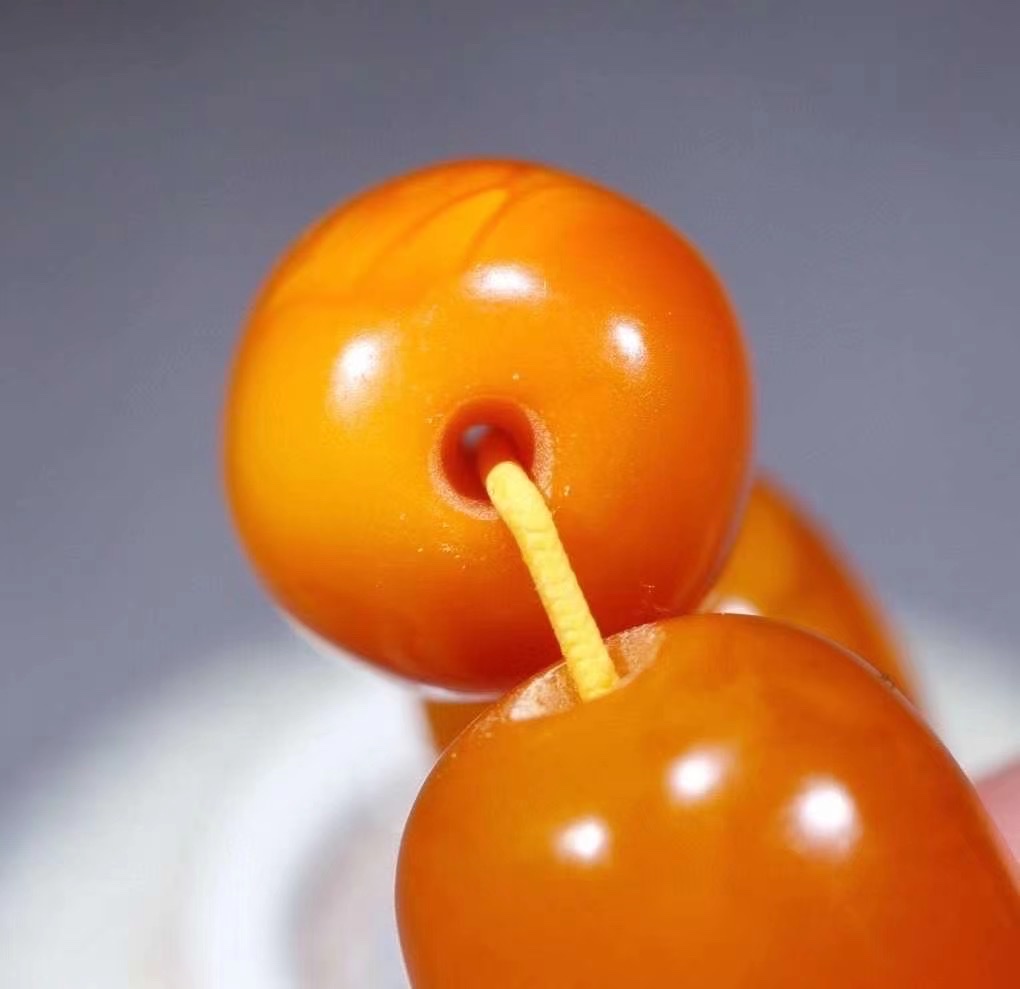 Old amber barrel beads detail image 4